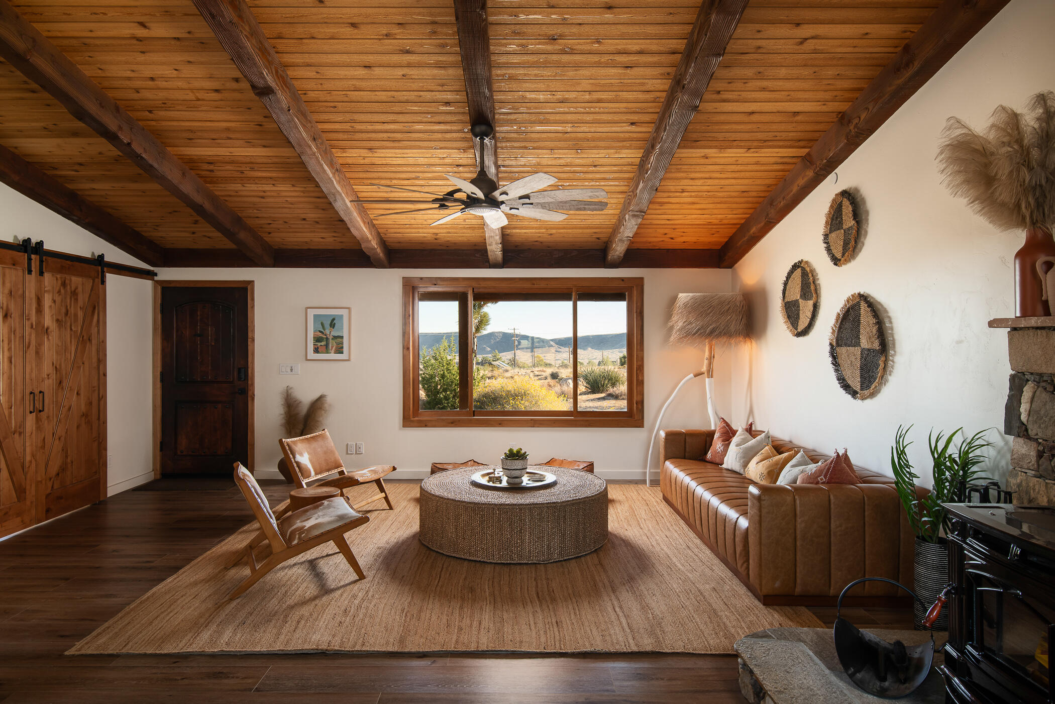 5544 Roy Rogers Road Pioneertown, CA 92268 - Photo 8 of 35 a living room with furniture and a large window
