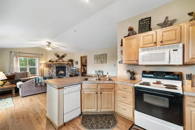 a kitchen with a stove oven and sink