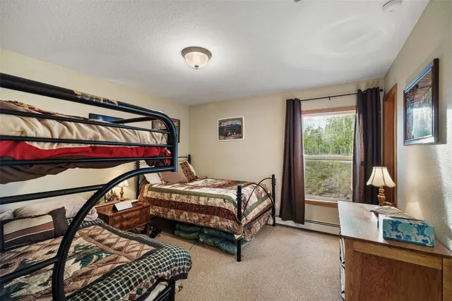 a view of room with window and cabinet