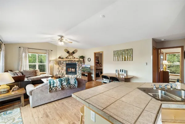 a living room with furniture and a chandelier