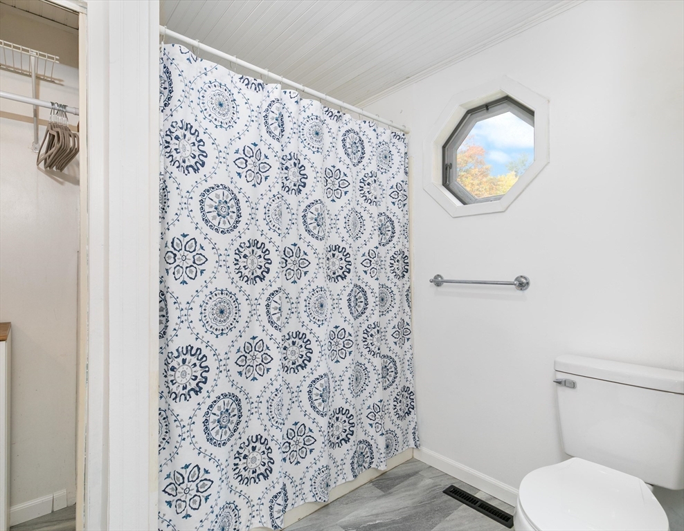 80 Brandy Brow Road Haverhill, MA 01830 - Photo 13 of 33 a bathroom with a toilet and a mirror