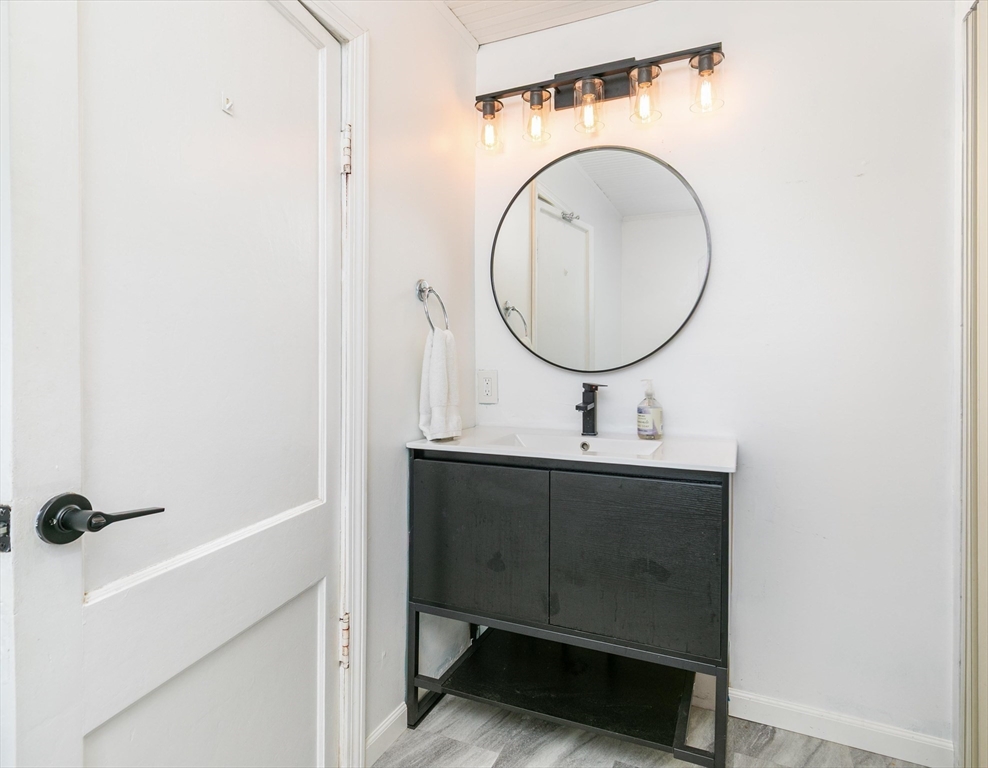 80 Brandy Brow Road Haverhill, MA 01830 - Photo 14 of 33 a bathroom with a sink and a mirror