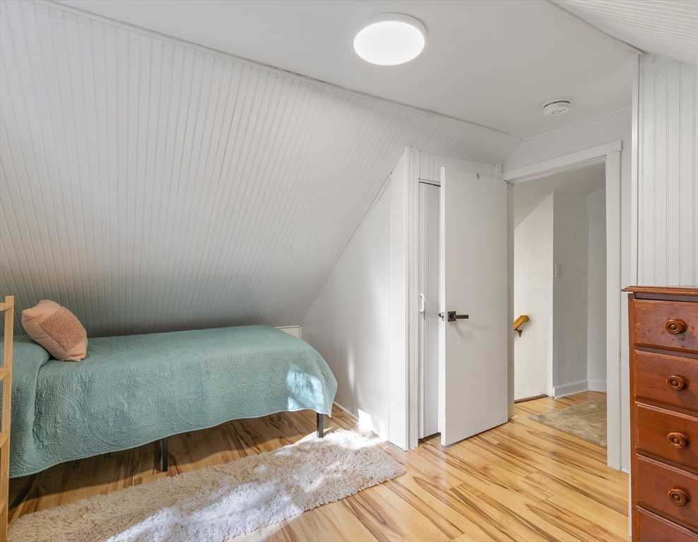 80 Brandy Brow Road Haverhill, MA 01830 - Photo 18 of 33 a bedroom with a bed and wooden floor