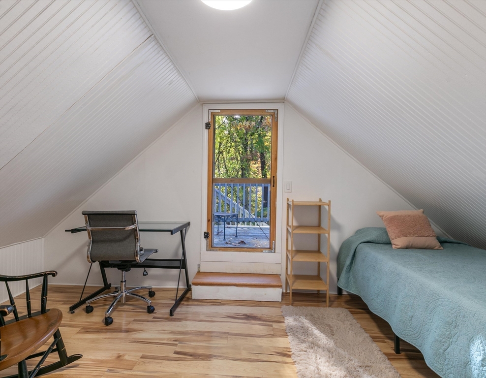 80 Brandy Brow Road Haverhill, MA 01830 - Photo 19 of 33 a bedroom with a bed and a chair