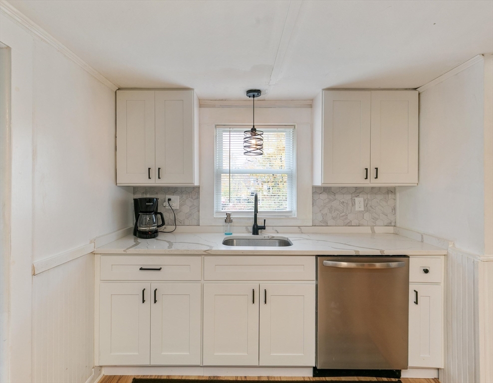 80 Brandy Brow Road Haverhill, MA 01830 - Photo 5 of 33 a kitchen with white cabinets white appliances sink and window