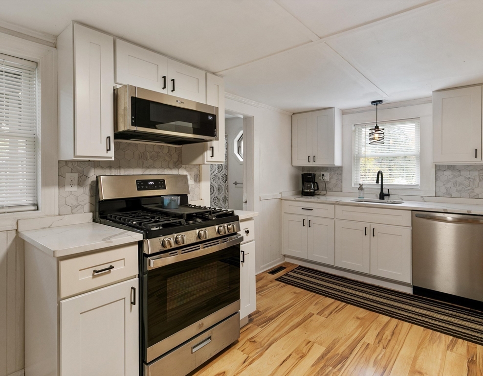 80 Brandy Brow Road Haverhill, MA 01830 - Photo 6 of 33 a kitchen with a stove microwave and sink