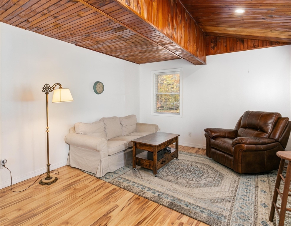 80 Brandy Brow Road Haverhill, MA 01830 - Photo 9 of 33 a living room with furniture and a wooden floor