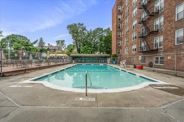 a view of a swimming pool with a patio