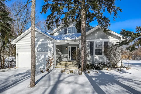 a view of a house with a tree