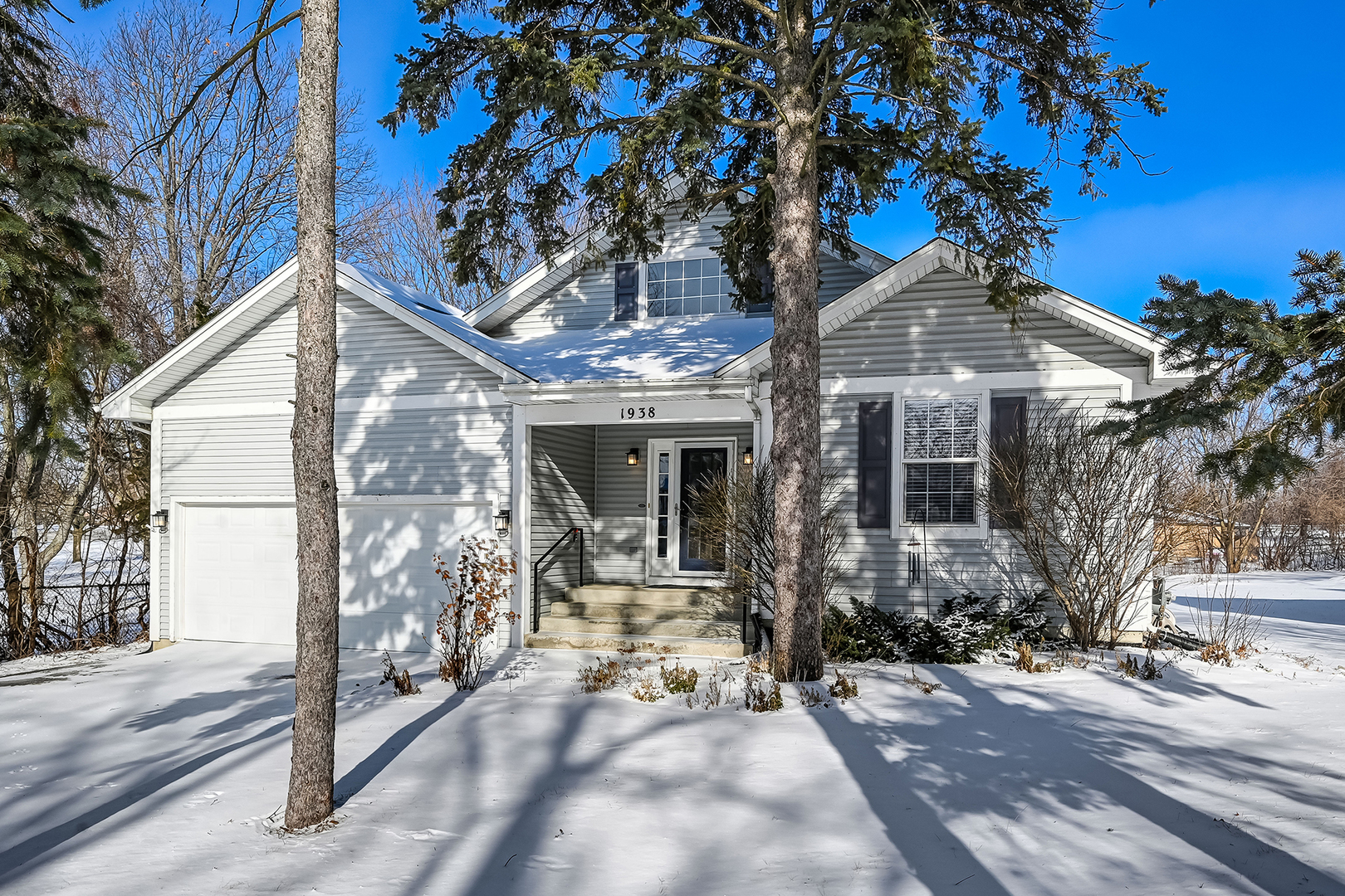 a view of a house with a tree