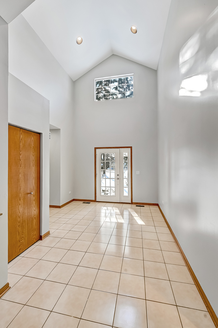 1938 Manning Road Darien, IL 60561 - Photo 2 of 23 a view of an empty room and window