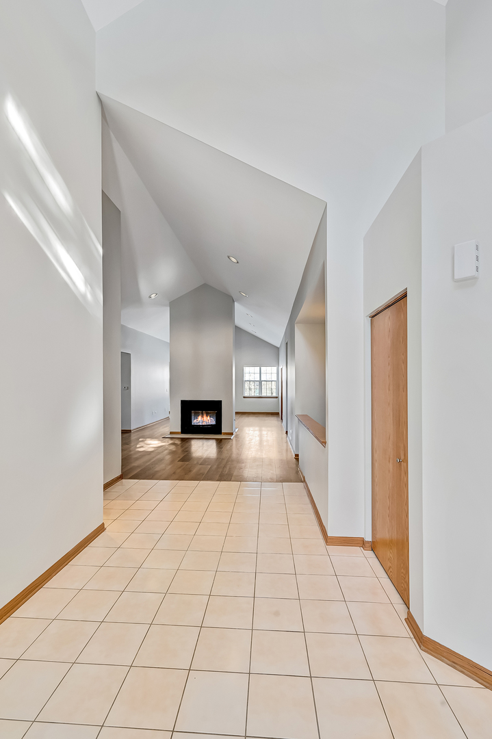 1938 Manning Road Darien, IL 60561 - Photo 3 of 23 a view of a bathroom with sink and mirror