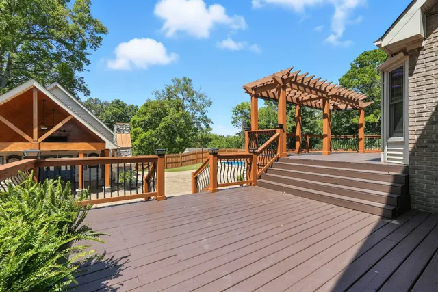 a front view of a house with a garden and plants