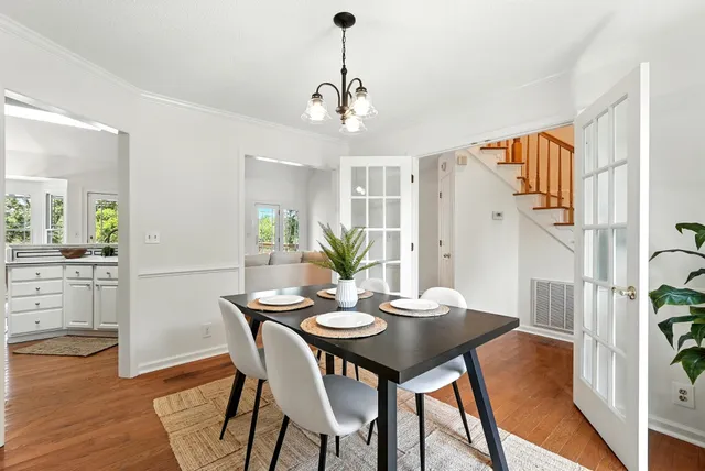 a view of a dining room with furniture window and wooden floor