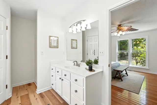 a white toilet sitting next to a bathroom sink