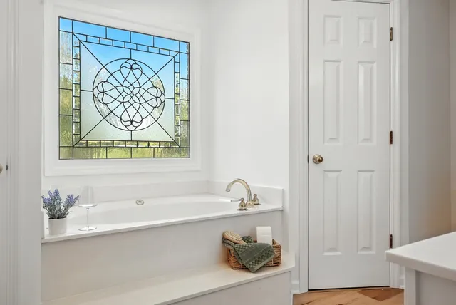 a view of an entryway with wooden floor