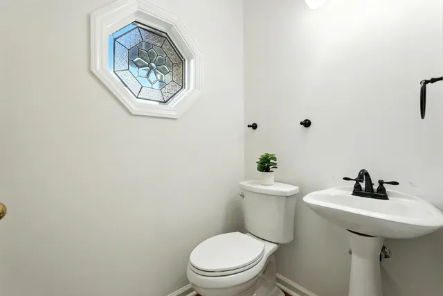a view of a chandelier fan and wooden floor