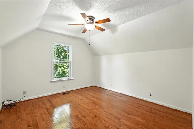 a view of balcony with wooden floor and outdoor seating