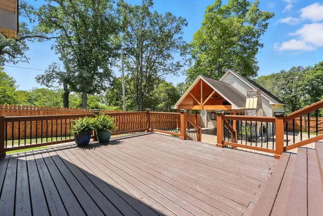a bathroom with a sink a toilet and a window