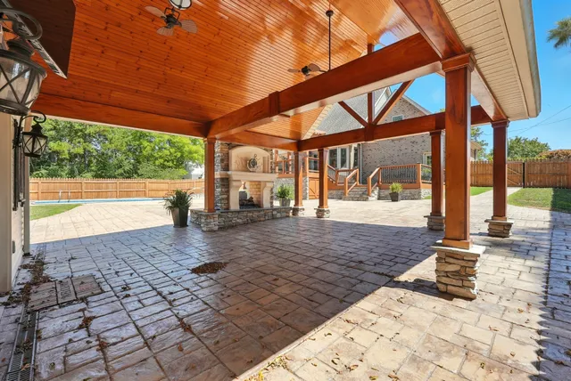 a view of swimming pool with a patio