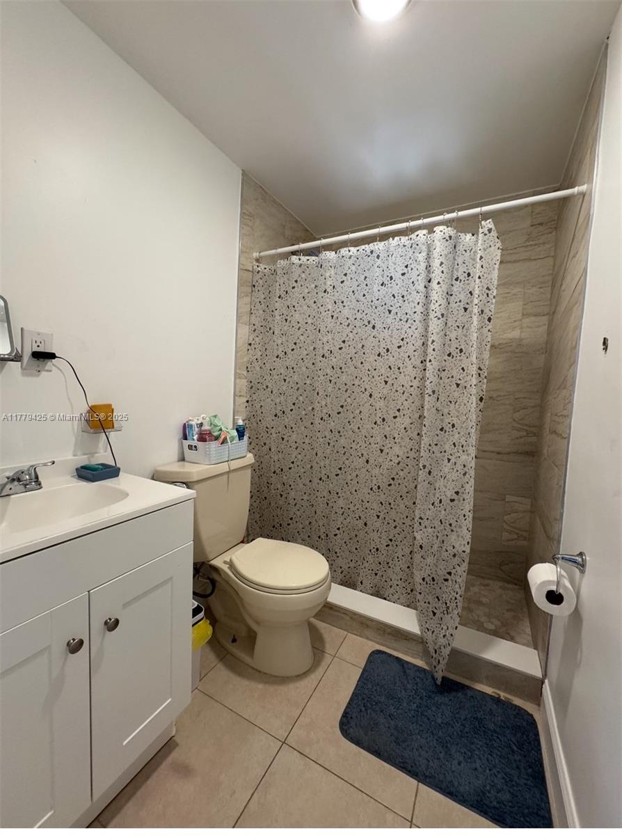602 East 50th Street Hialeah, FL 33013 - Photo 12 of 20 a bathroom with a sink toilet and shower