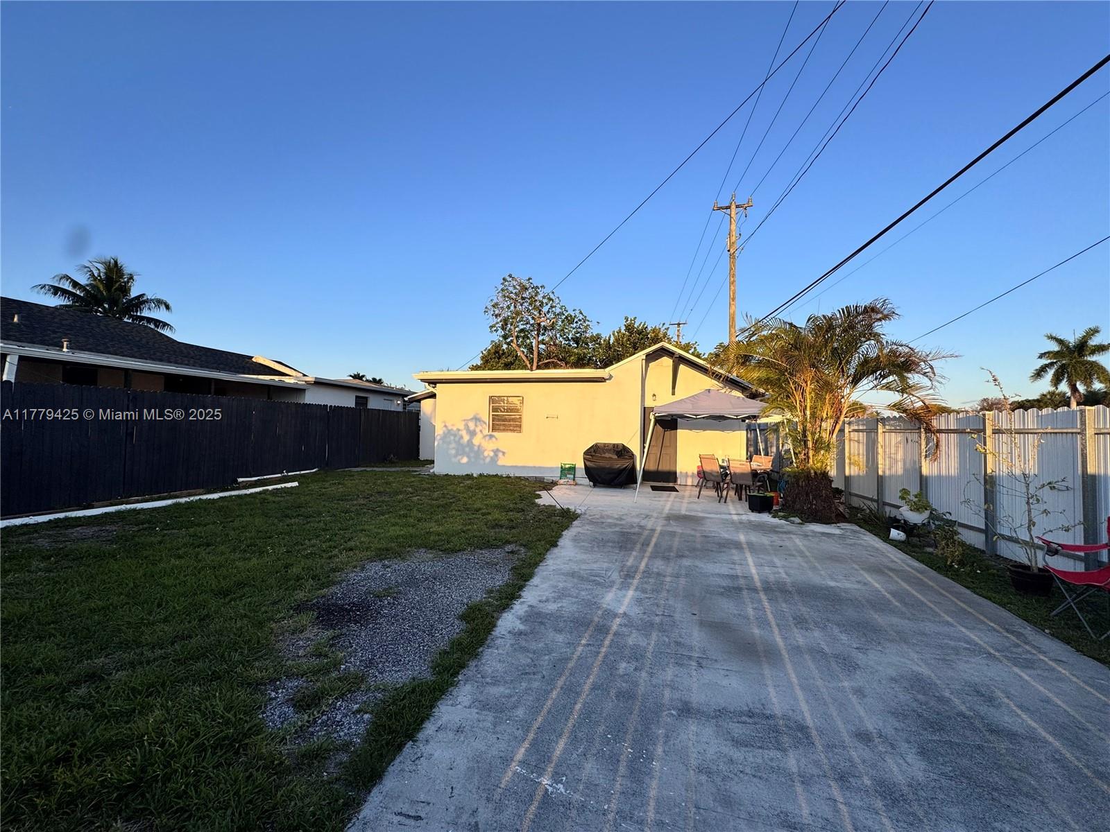 602 East 50th Street Hialeah, FL 33013 - Photo 16 of 20 a view of multiple house with a yard