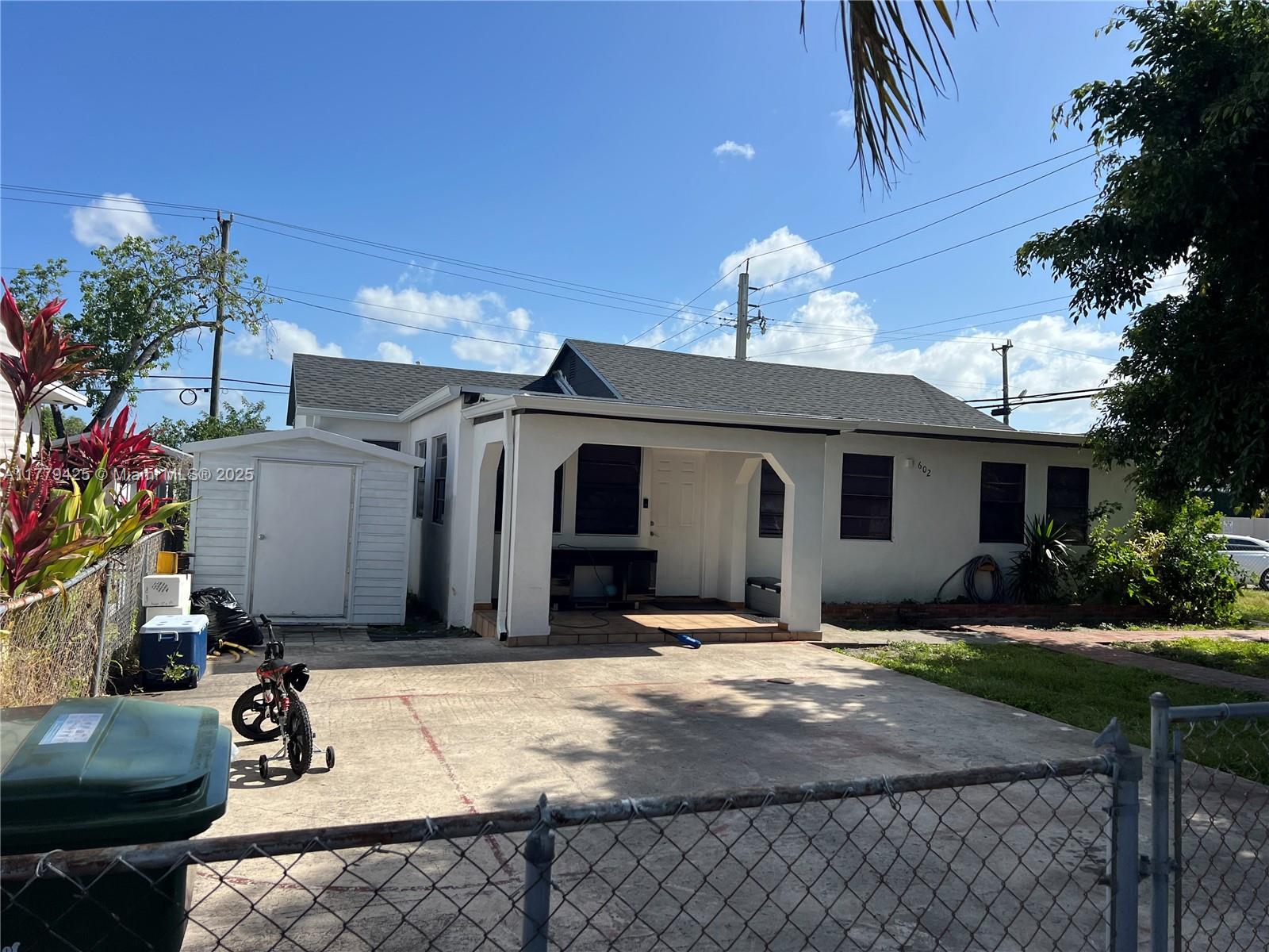 602 East 50th Street Hialeah, FL 33013 - Photo 2 of 20 a view of a house with yard and sitting area