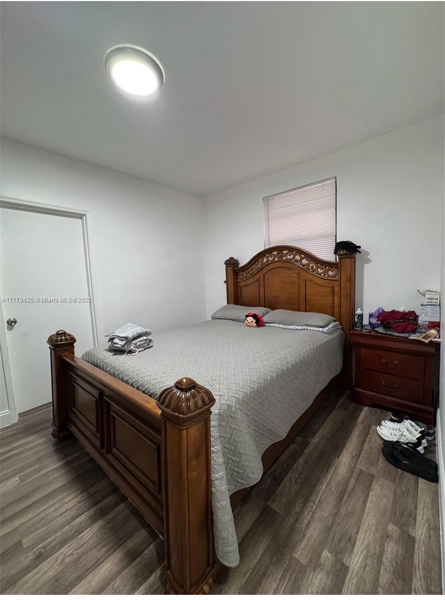602 East 50th Street Hialeah, FL 33013 - Photo 8 of 20 a bedroom with a bed and a dresser