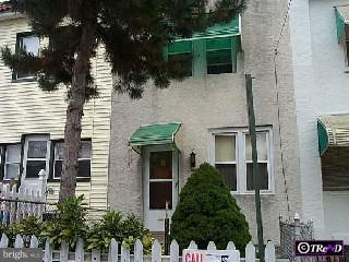 56 Springton Road Upper Darby, PA 19082 - Photo 1 of 1 a view of a house with a yard and potted plants
