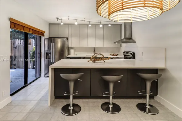 a kitchen with a sink cabinets and appliances