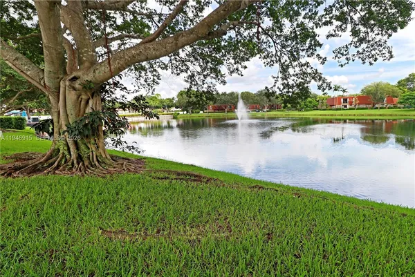 a view of a lake with a house in the background