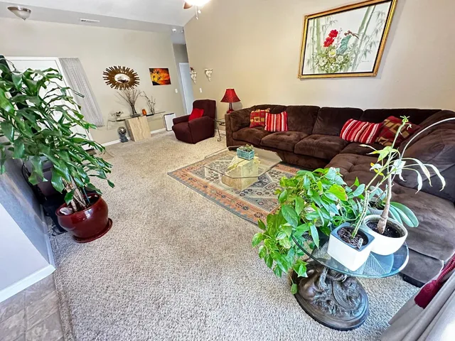 a kitchen that has a lot of cabinets and refrigerator