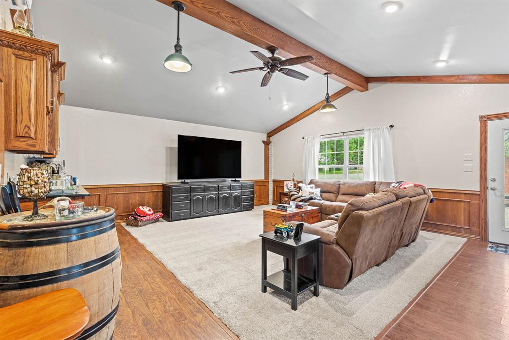 934 North Maple Street Muenster, TX 76252 - Photo 22 of 39 a living room with furniture and a flat screen tv
