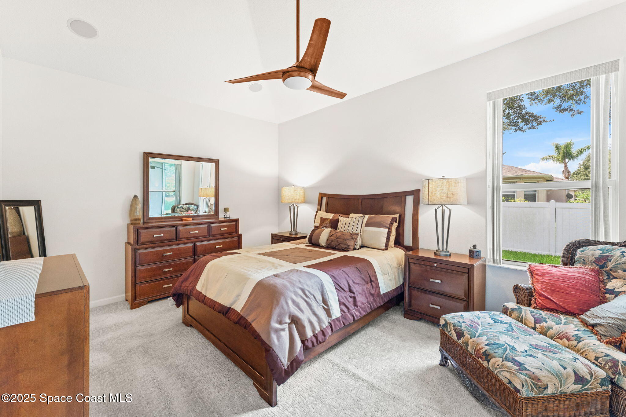 1910 Muirfield Way Southeast, Unit B Palm Bay, FL 32909 - Photo 11 of 34 a bedroom with two beds and a painting on the wall