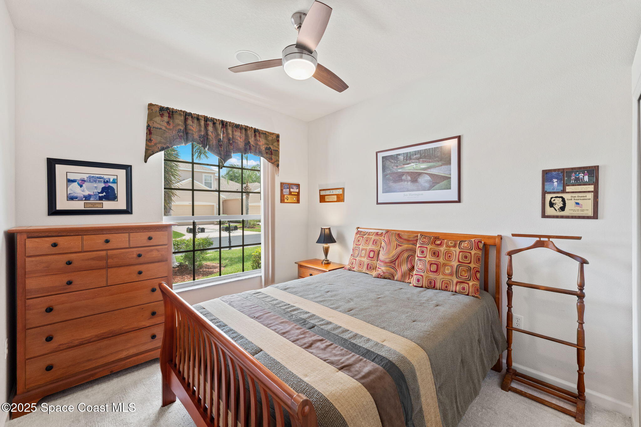 1910 Muirfield Way Southeast, Unit B Palm Bay, FL 32909 - Photo 15 of 34 a bedroom with a bed and a dresser