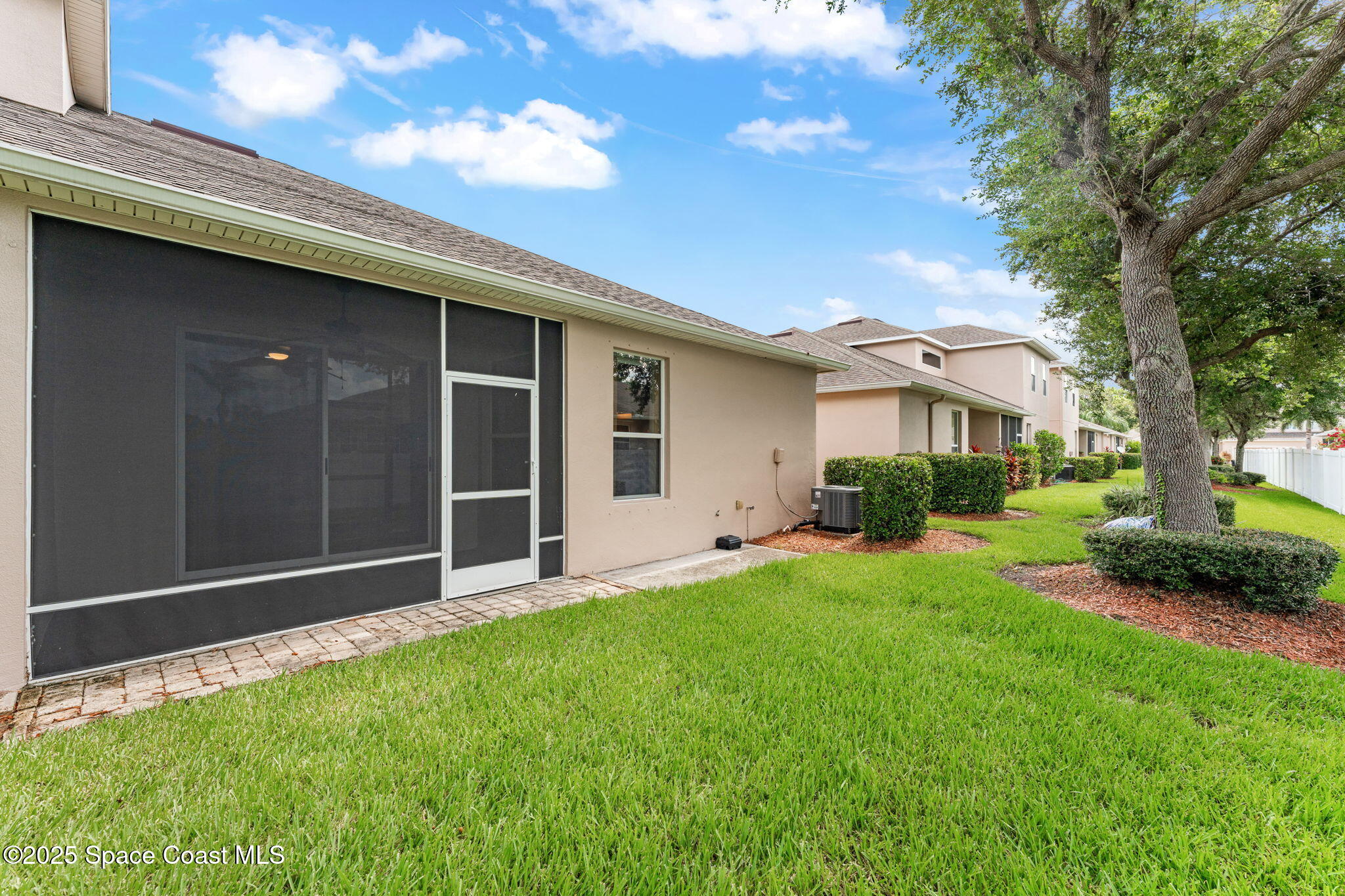 1910 Muirfield Way Southeast, Unit B Palm Bay, FL 32909 - Photo 19 of 34 a view of backyard with a garden and plants