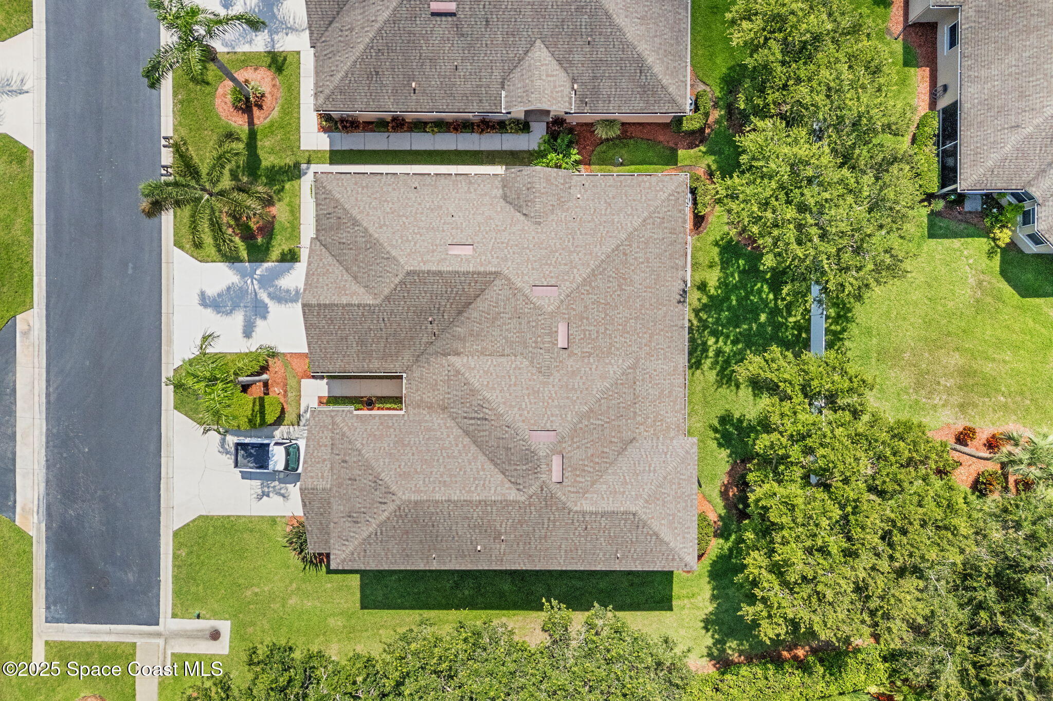 1910 Muirfield Way Southeast, Unit B Palm Bay, FL 32909 - Photo 23 of 34 an aerial view of a house with a garden