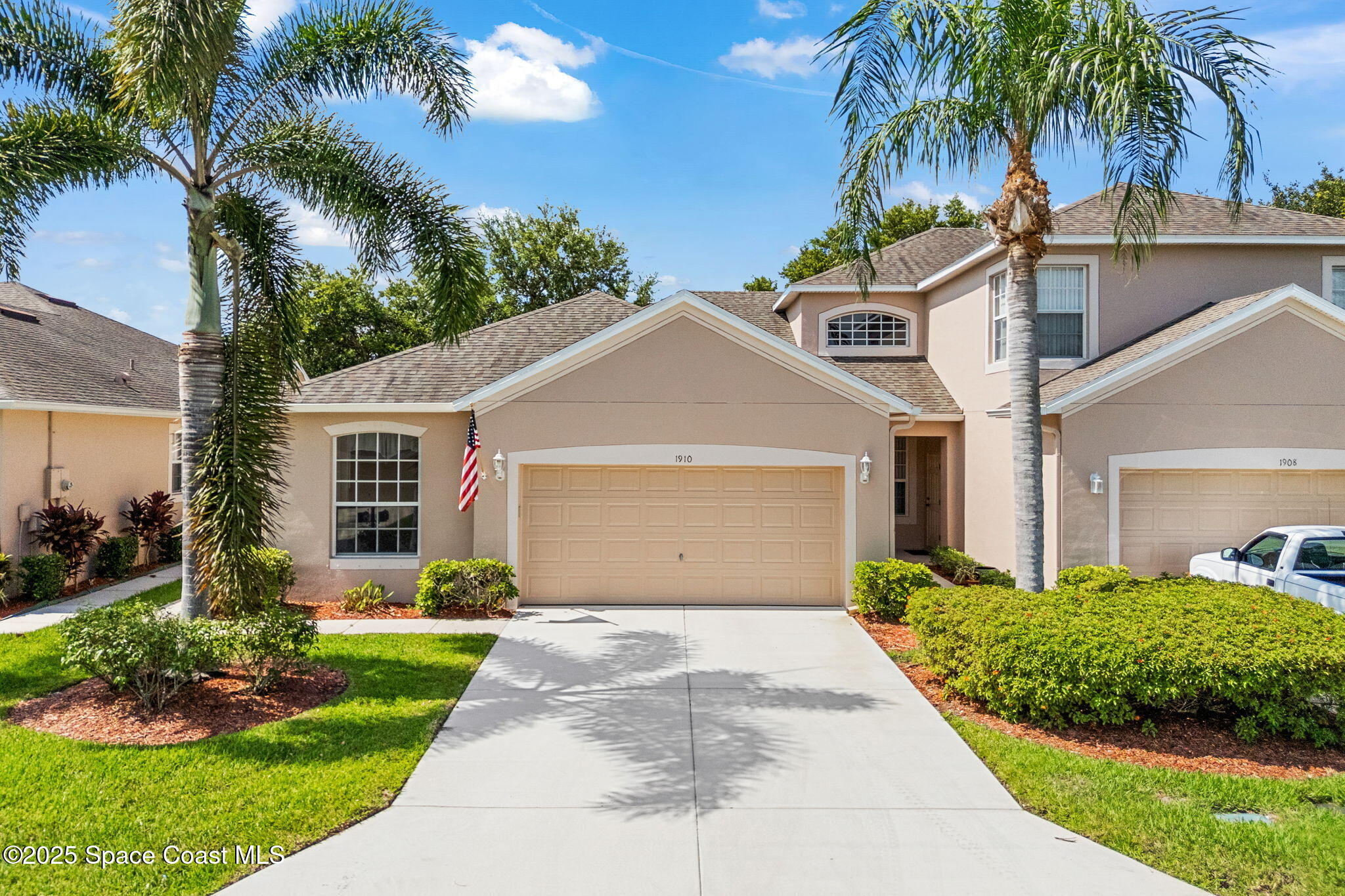 1910 Muirfield Way Southeast, Unit B Palm Bay, FL 32909 - Photo 24 of 34 a front view of house with yard and green space
