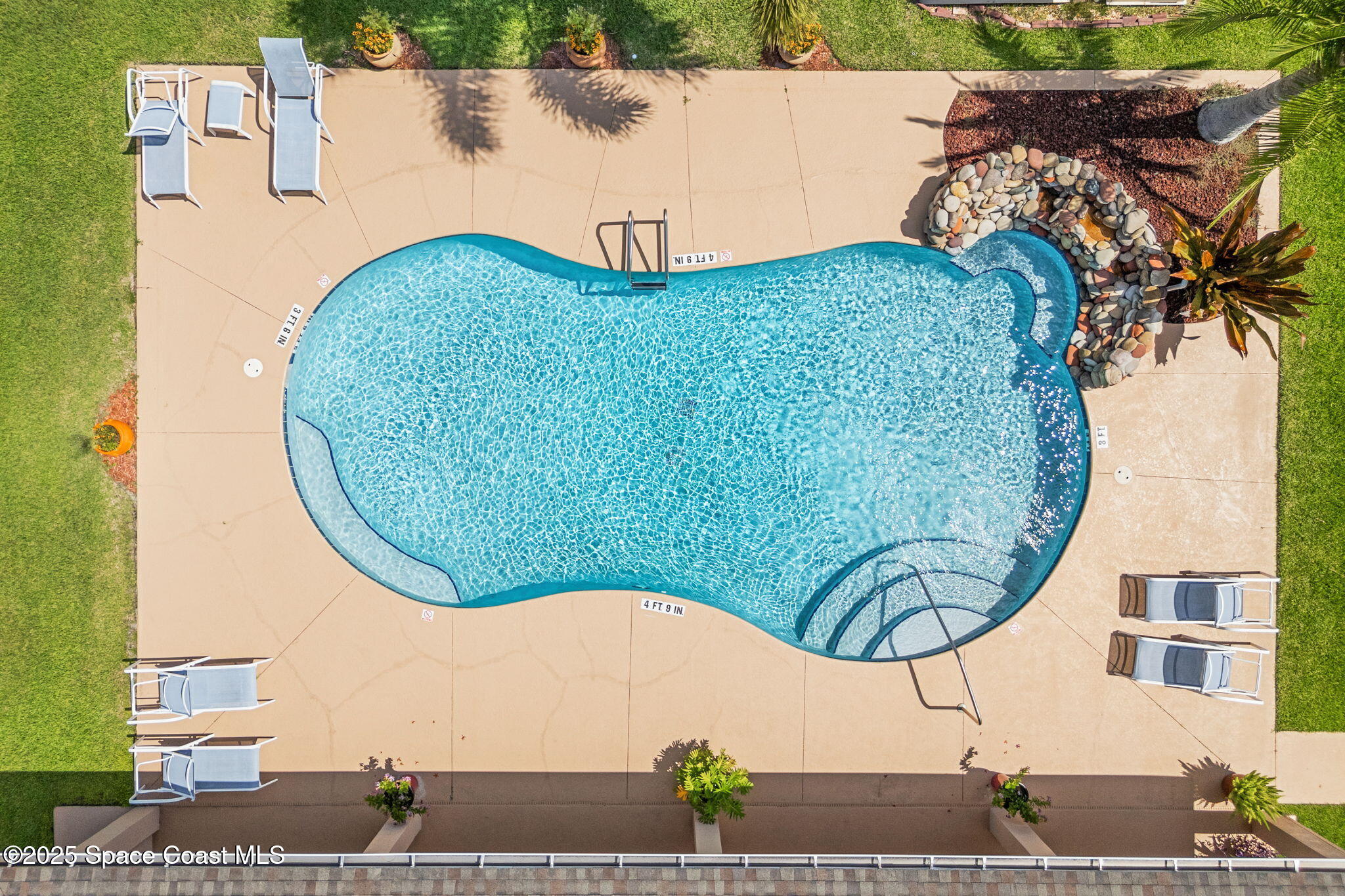 1910 Muirfield Way Southeast, Unit B Palm Bay, FL 32909 - Photo 27 of 34 an aerial view of a house