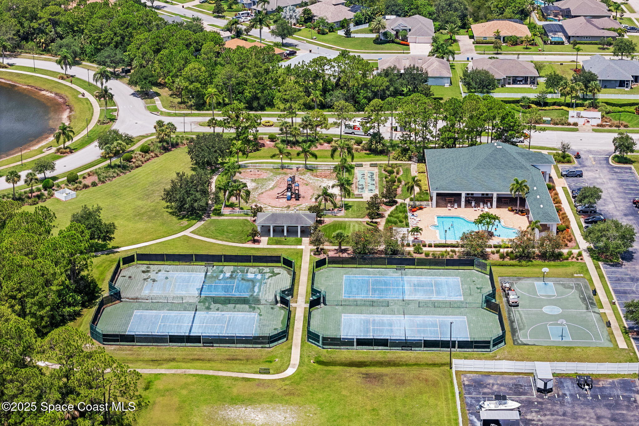 1910 Muirfield Way Southeast, Unit B Palm Bay, FL 32909 - Photo 28 of 34 a view of swimming pool with outdoor seating and yard