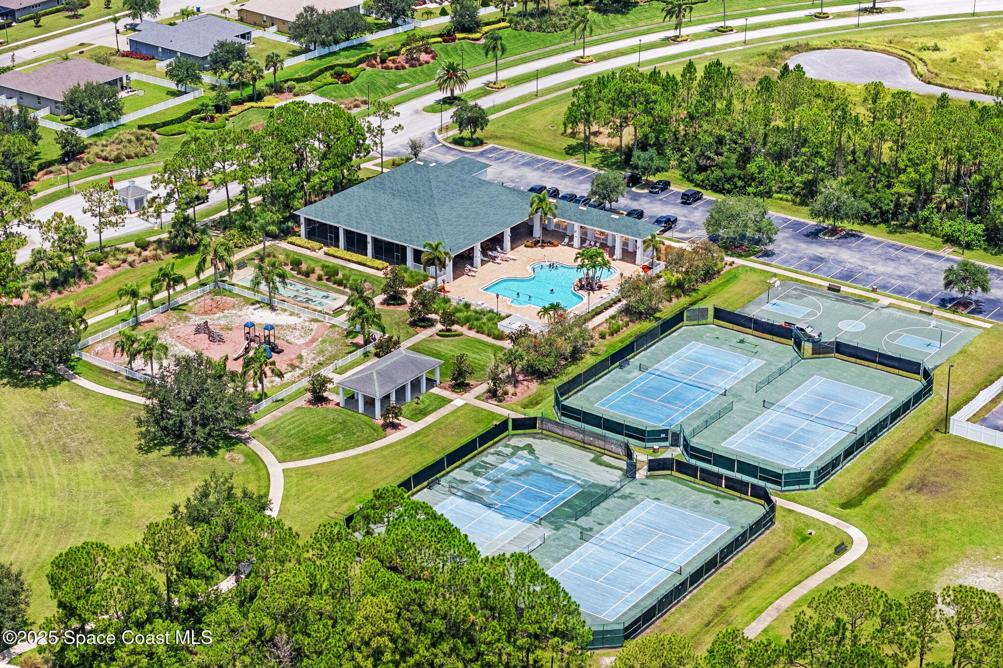 1910 Muirfield Way Southeast, Unit B Palm Bay, FL 32909 - Photo 29 of 34 an aerial view of a house with swimming pool garden and patio