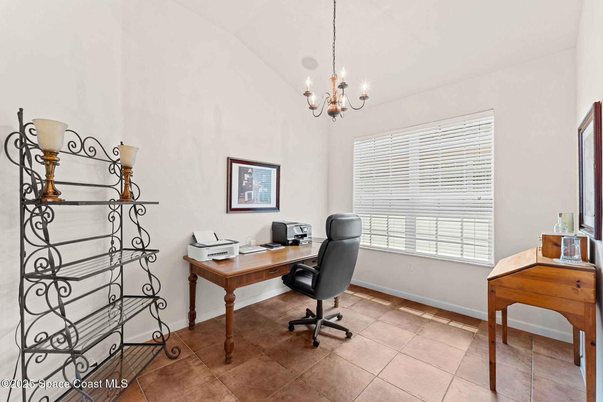 1910 Muirfield Way Southeast, Unit B Palm Bay, FL 32909 - Photo 5 of 34 a view of a workspace with furniture and a window