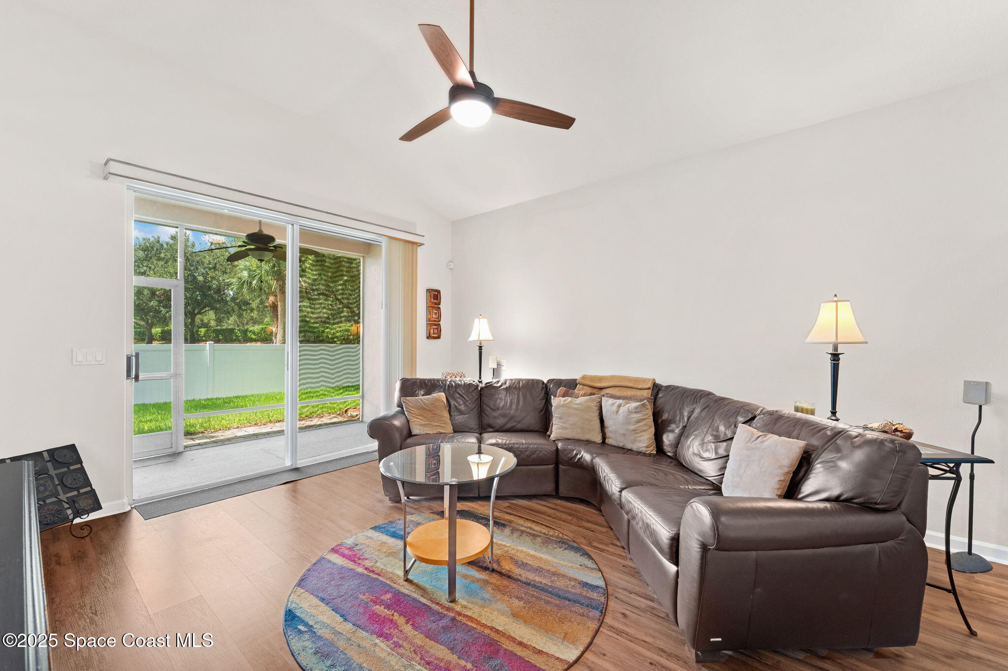 1910 Muirfield Way Southeast, Unit B Palm Bay, FL 32909 - Photo 7 of 34 a living room with furniture and a large window