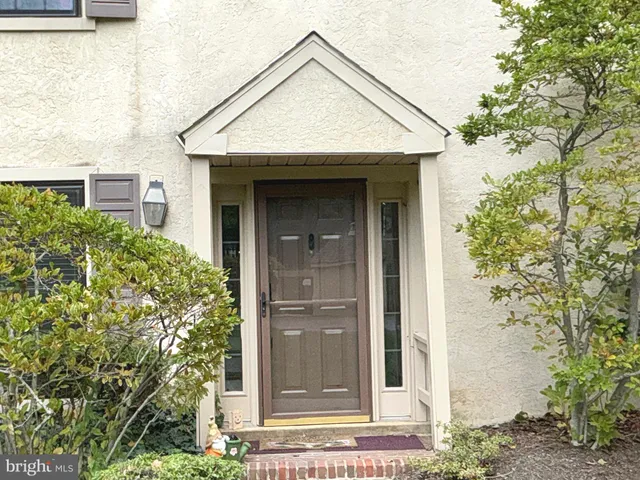 a view of a brick house with a small entryway