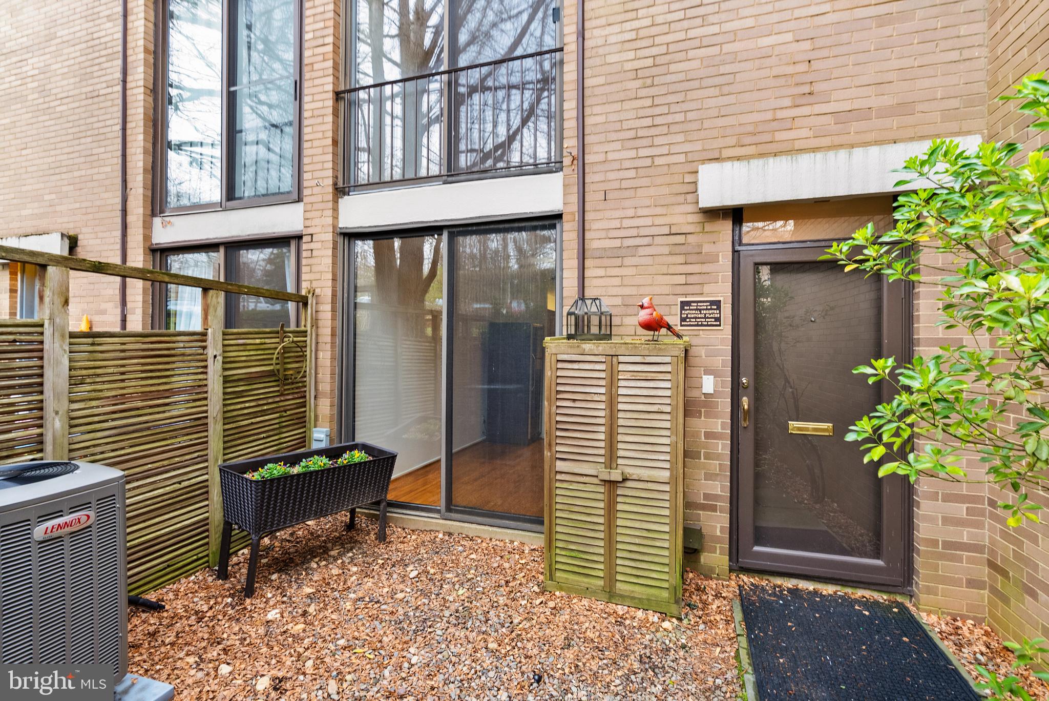 a potted plant sitting in front of a house