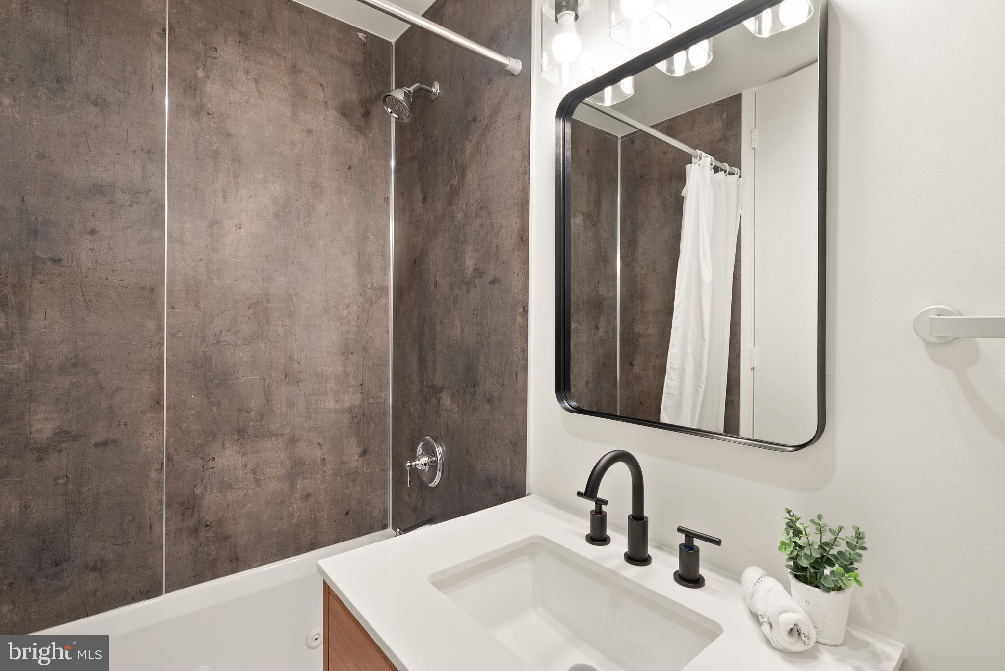 11465 Washington Plaza West Reston, VA 20190 - Photo 21 of 45 Ensuite Bath #1 with new vanity, floors & toilet