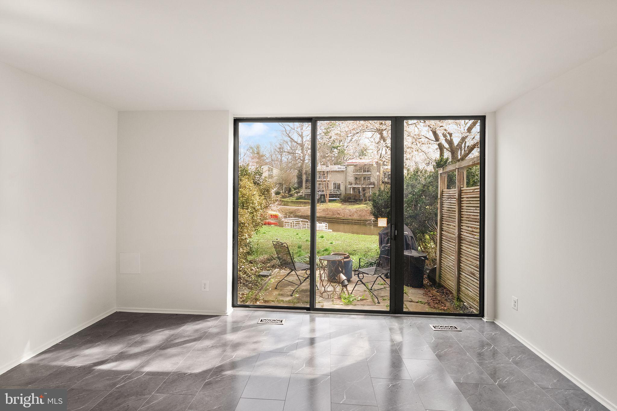 11465 Washington Plaza West Reston, VA 20190 - Photo 40 of 45 Lower level - opens up to backyard and the lake!