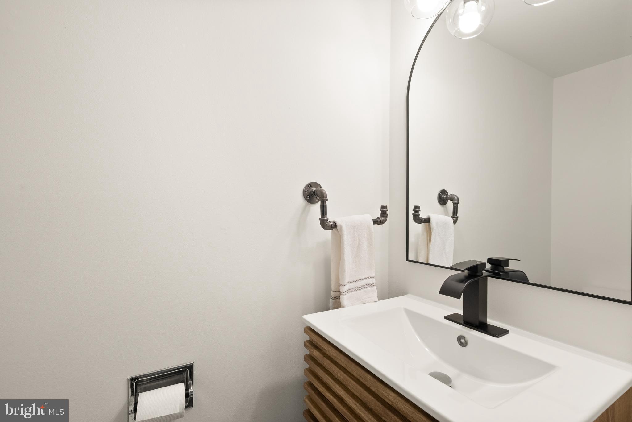 11465 Washington Plaza West Reston, VA 20190 - Photo 41 of 45 Lower level - Half bath with new vanity and toilet