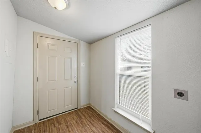 a view of a room that has a window in it