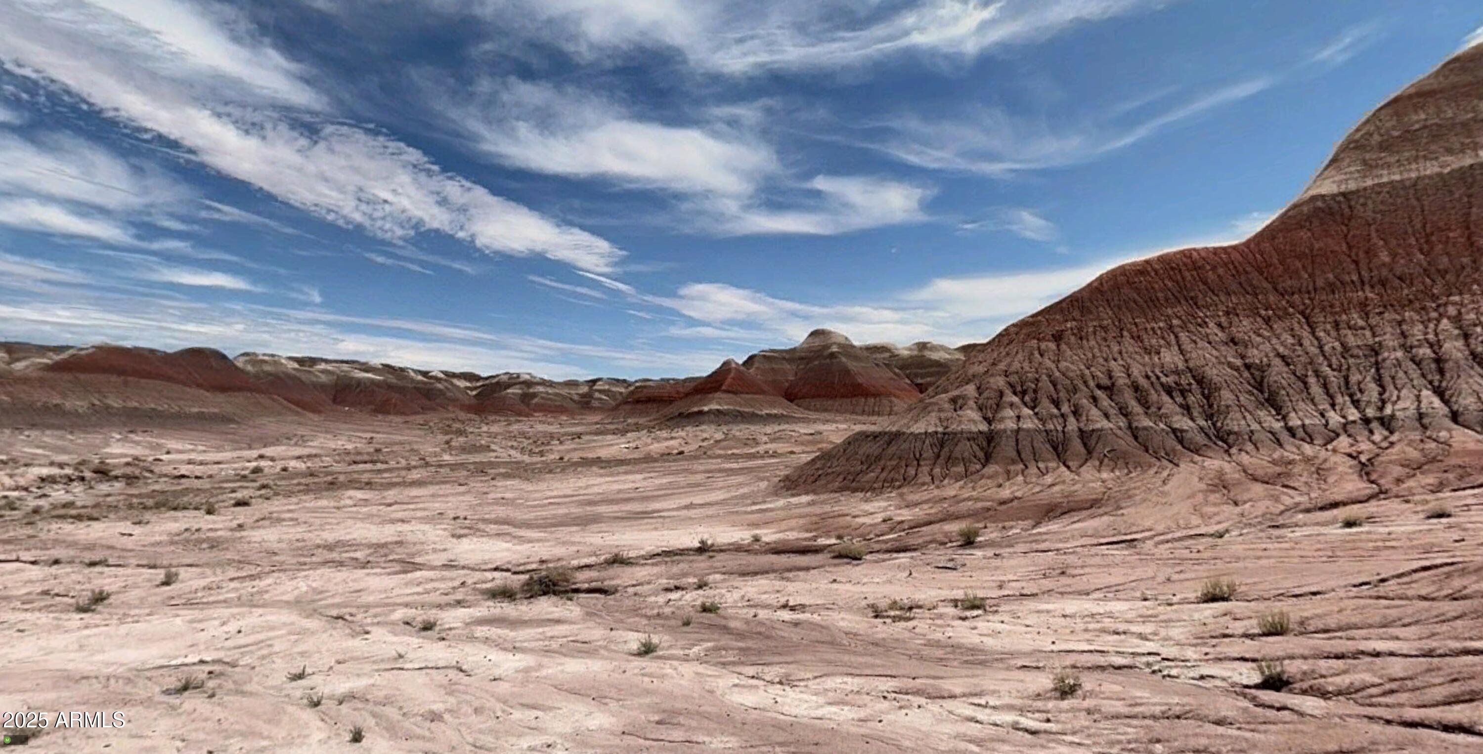 0 Un-named Road Joseph City, AZ 86032 - Photo 7 of 15 a view of a dry yard with mountains in the background